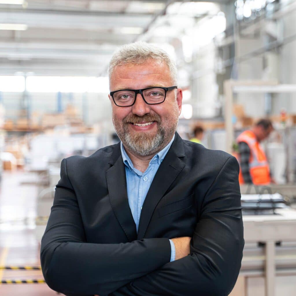 Manufacturing Leader stands in home product manufacturing plant