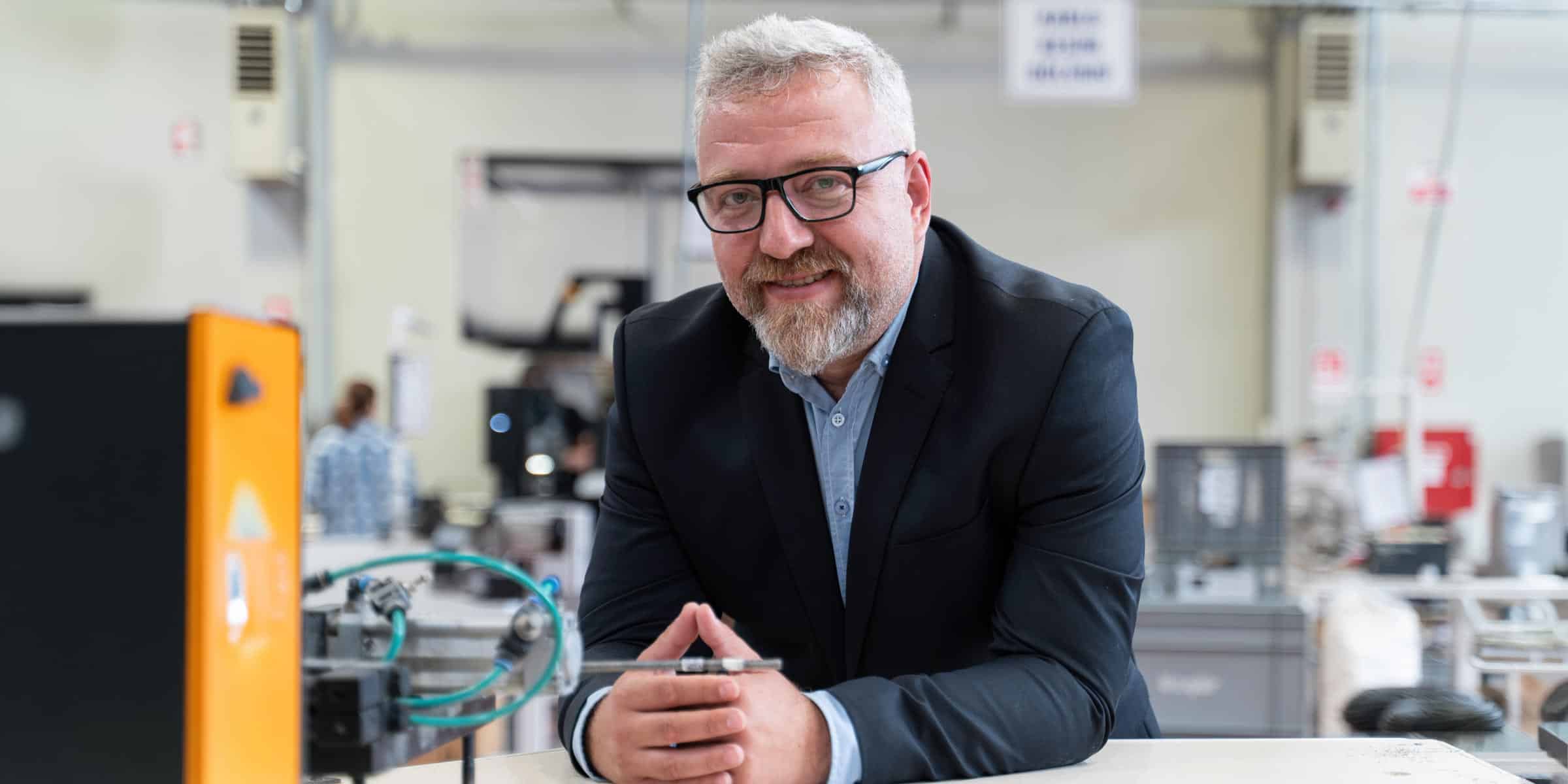 Manufacturing Leader poses in home product manufacturing plant