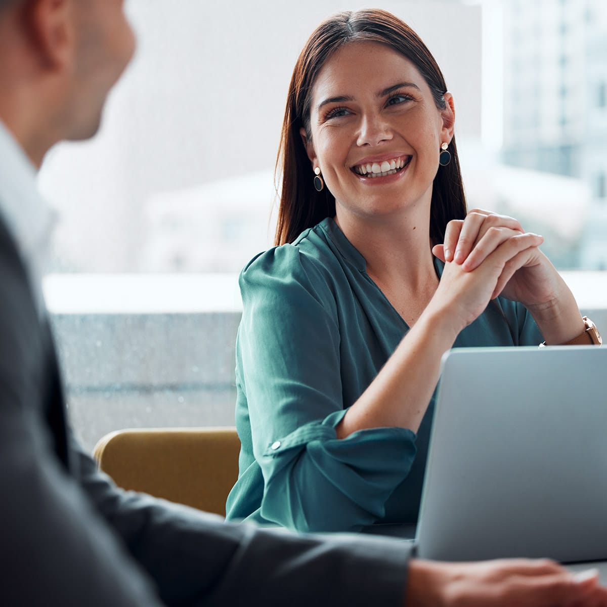 Female manufacturing marketing leaders meets with marketing operations lead.